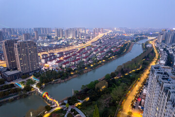 Fototapeta premium Aerial View of a Vibrant Urban Cityscape at Dusk