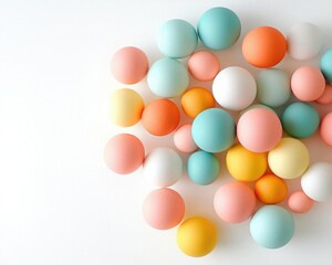 A colorful assortment of round balls in various pastel shades scattered on a white surface.