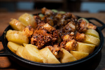 Galician-style Octopus served in black iron pan
