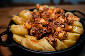 Galician-style Octopus served in black iron pan