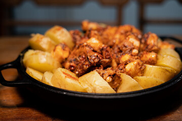 Galician-style Octopus served in black iron pan