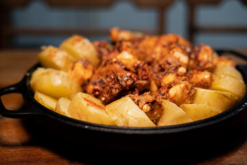 Galician-style Octopus served in black iron pan