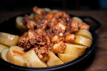 Galician-style Octopus served in black iron pan