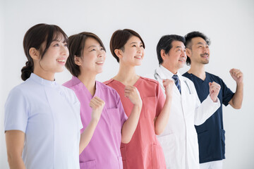 Image of side-by-side medical professionals looking up to the future with gut-punching glee at doctors' and nurses' joyful and successful career changes, etc.