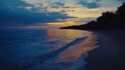 Serene sunset over tranquil ocean beach.