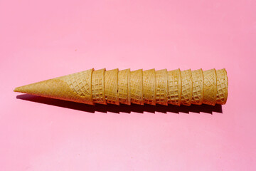 Waffle cones on pink background