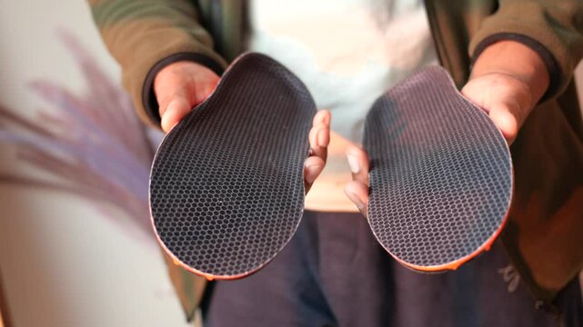 Visual comparison of two shoe insoles showcasing design and texture differences