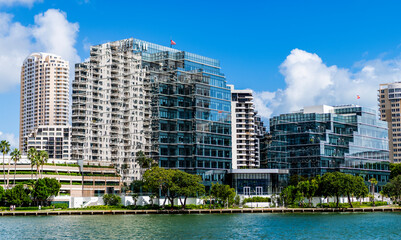 Fototapeta premium Modern glass building. Skyscraper in business city. City downtown with skyscraper. Office building in city district. Brickell Key. Skyscraper building architecture. Skyscraper with glassy exterior