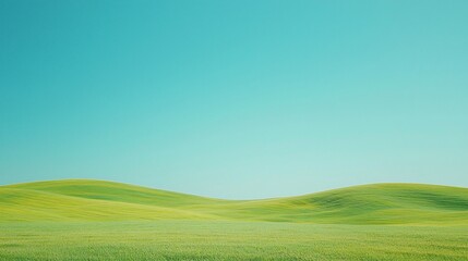 Obraz premium Serene rolling green hills under a clear blue sky.