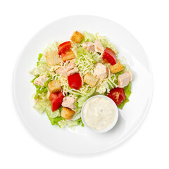 Caesar salad with chicken and fresh vegetables, on a white background, isolated. Top view.