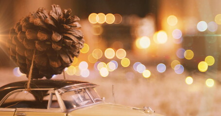 Image of pine cone on car model with glowing lights