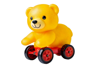 Yellow Plastic Toy Bear on Wheels isolated on a transparent or white background