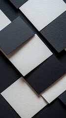 Fototapeta premium A black and white photo of a patterned surface. The pattern is made up of squares and rectangles