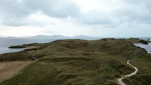 Aerial view across Ynys Llanddwyn island idyllic landscape with Snowdonia mountains skyline