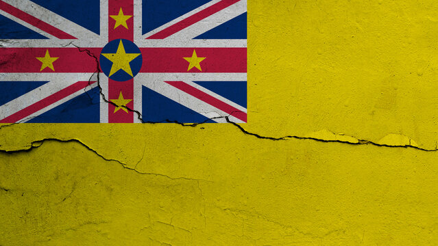 Niue flag on cracked wall background, flag with crack line
