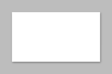 white frame on a wall, blank white paper 