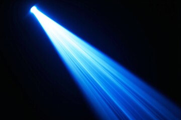 A vivid blue spotlight beam cutting through darkness, radiating soft and dynamic light streaks. Concept of focus, illumination, and energy. Ai generative