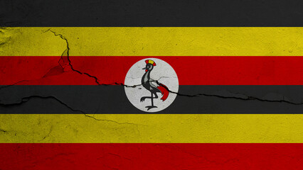 Uganda flag on cracked wall background, flag with crack line