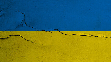 Ukraine flag on cracked wall background, flag with crack line