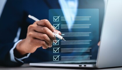 hand is marking a checklist graphic overlaying a laptop, with a pen.