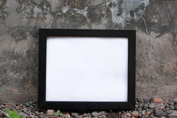 A versatile stock photo showcasing a black frame set against a backdrop of a concrete wall and...