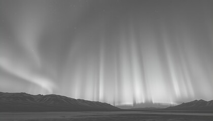 Monochromatic Aurora Borealis over a Mountain Range