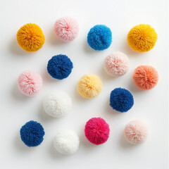 Colorful handmade pom-poms on white background