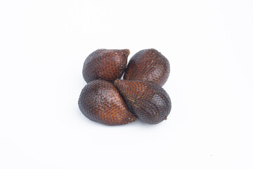 Group of salak or snake fruits with distinct brown scaly skin, isolated on white background