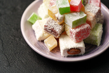 Colorful assortment of traditional sweet treats served on a decorative plate