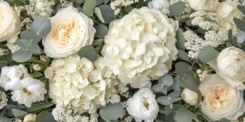 Elegant floral arrangement of cream and white flowers with Hydrangea, Peony, and Eucalyptus showcasing empty space for text celebration
