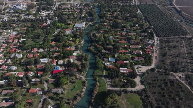 Aerial view over Kibbutz Nir David with Asi river
Drone view from Israel, 2024
