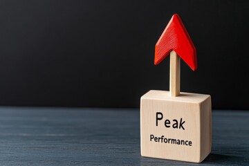 Peak Performance Concept with Red Arrow on Wooden Block Against Black Background - Business Success and Growth