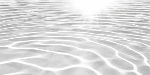 Sunlit water surface with gentle ripples and light reflections.