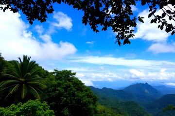 Obraz premium Green landscape with blue clear sky with white clouds. 