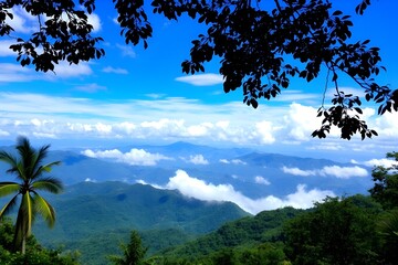 Green landscape with blue clear sky with white clouds.	