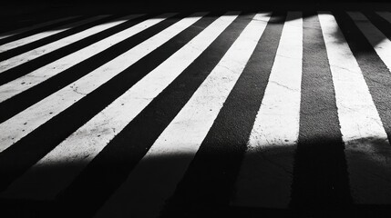 Black and white stripes of a crosswalk at night. © Erisna Yolanda