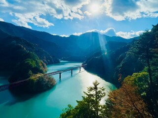 tourist attractions in Japan. Beautiful scenery. Green lake between mountains and train tracks in Shizuoka, Japan