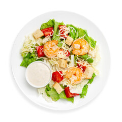Caesar salad with shrimps and fresh vegetables, on a white background, isolated. Top view.