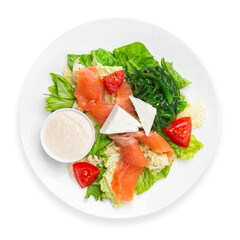 Salad with salmon and fresh vegetables and cheese, on a white background, isolated. Top view.