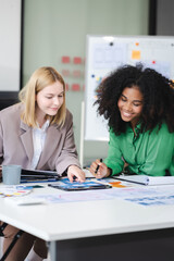 Fototapeta premium UX developer and ui designer brainstorming about mobile app interface wireframe design with customer breif and color code, User experience concept..