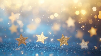 Gold stars on blue glitter bokeh background.