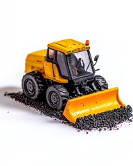 Obraz premium A yellow model bulldozer toy on a white background, demonstrating its construction features and detailed design, perfect for collectors and enthusiasts.