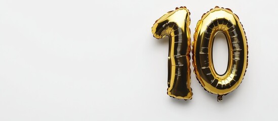 Gold and black number 10 helium foil balloon on white background ideal for birthday celebration anniversary milestone party decorations