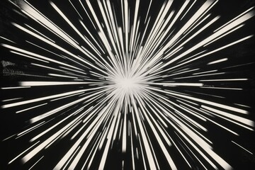 Abstract black and white image depicting radiating lines converging at a central point, suggesting speed, movement, or light.