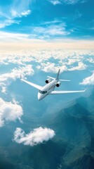 Fototapeta premium A Sleek Private Jet Flying Above the Clouds with Stunning Mountainous Landscape and Clear Blue Sky, Representing Luxury Travel and Adventure in Aviation
