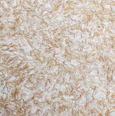 Mixed-material plaster texture featuring natural accents
