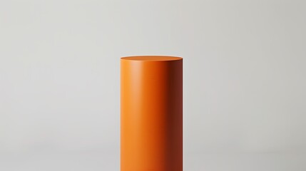 A vibrant orange cylinder with a smooth surface, elevated against a stark white background
