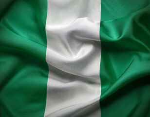Obraz premium Nigeria national flag waving in the sky behind the tree. The flag blow in beautiful sunlight. Nigeria national flag for independence day.