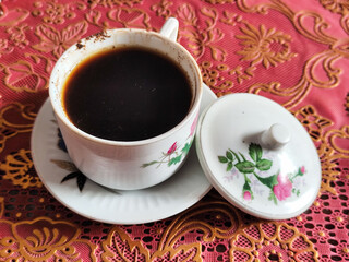 Coffee in a classic cup on the table,