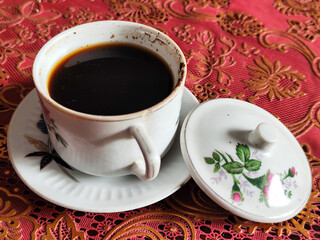 Coffee in a classic cup on the table,
